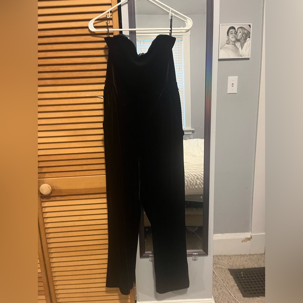 Velvet black jump suit. Size 6. Very cute and very flattering!